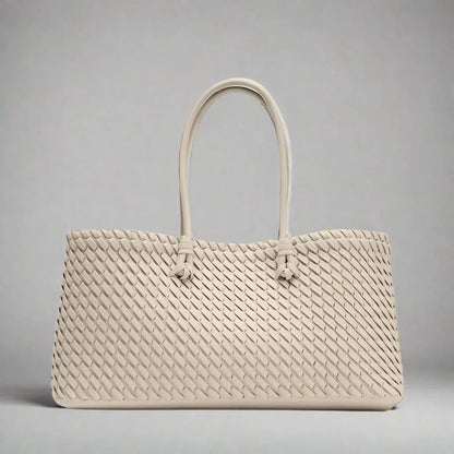 Elegant women's woven leather handbag, a versatile and sophisticated accessory for any look.