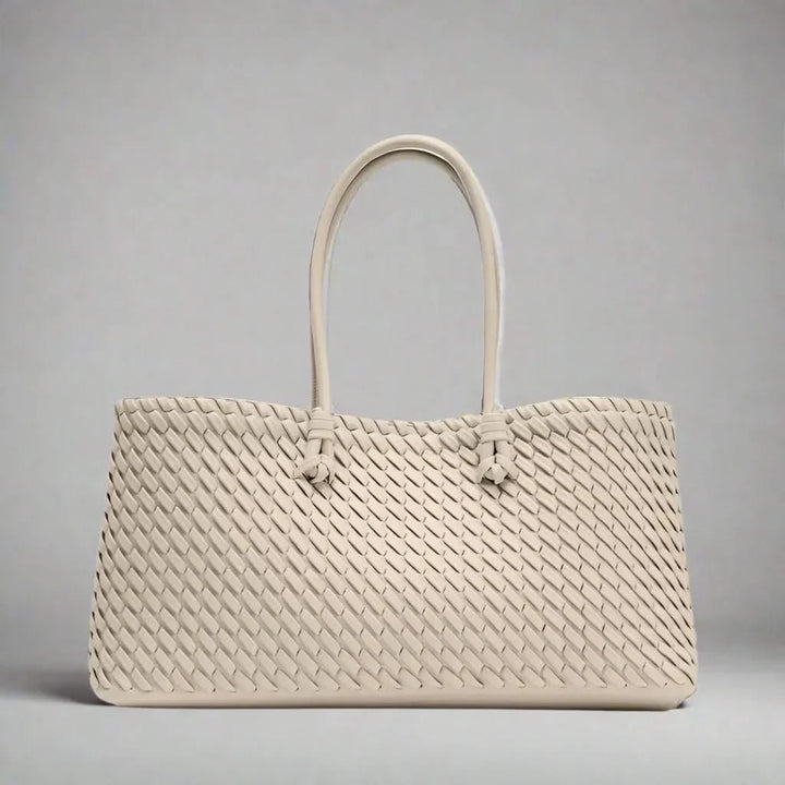 Elegant women's woven leather handbag, a versatile and sophisticated accessory for any look.