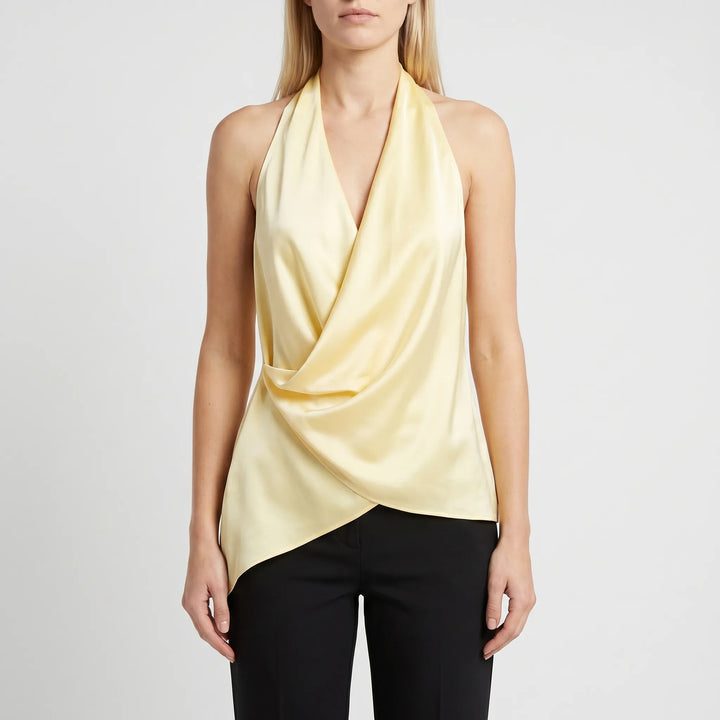 Elegant women's yellow halter top, draped and sleeveless with an asymmetrical hem, ideal for evening wear.