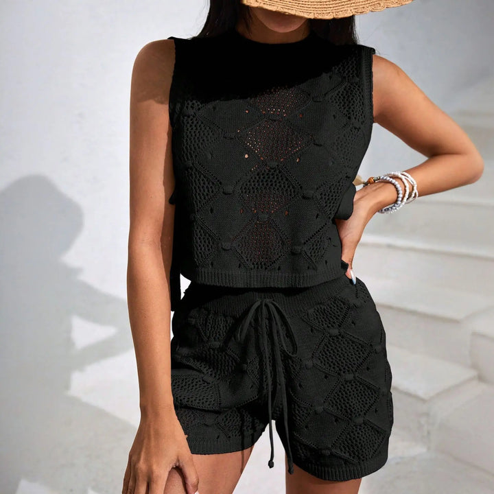 Complete women's summer outfit: Elira two-piece sleeveless crop top & high-waist shorts for any occasion.