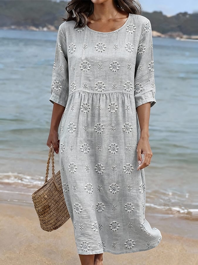 Women's embroidered floral midi dress with three-quarter sleeves & round neck. Perfect for summer casual wear.