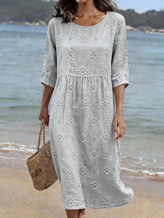 Women's embroidered floral midi dress with three-quarter sleeves & round neck. Perfect for summer casual wear.