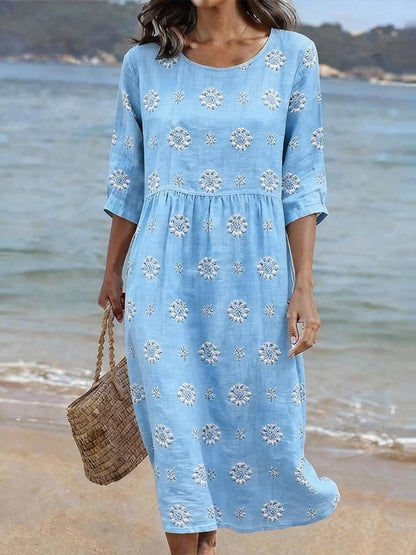 Elegant women's relaxed fit midi dress, featuring delicate floral embroidery. Ideal for spring vacation or day wear.