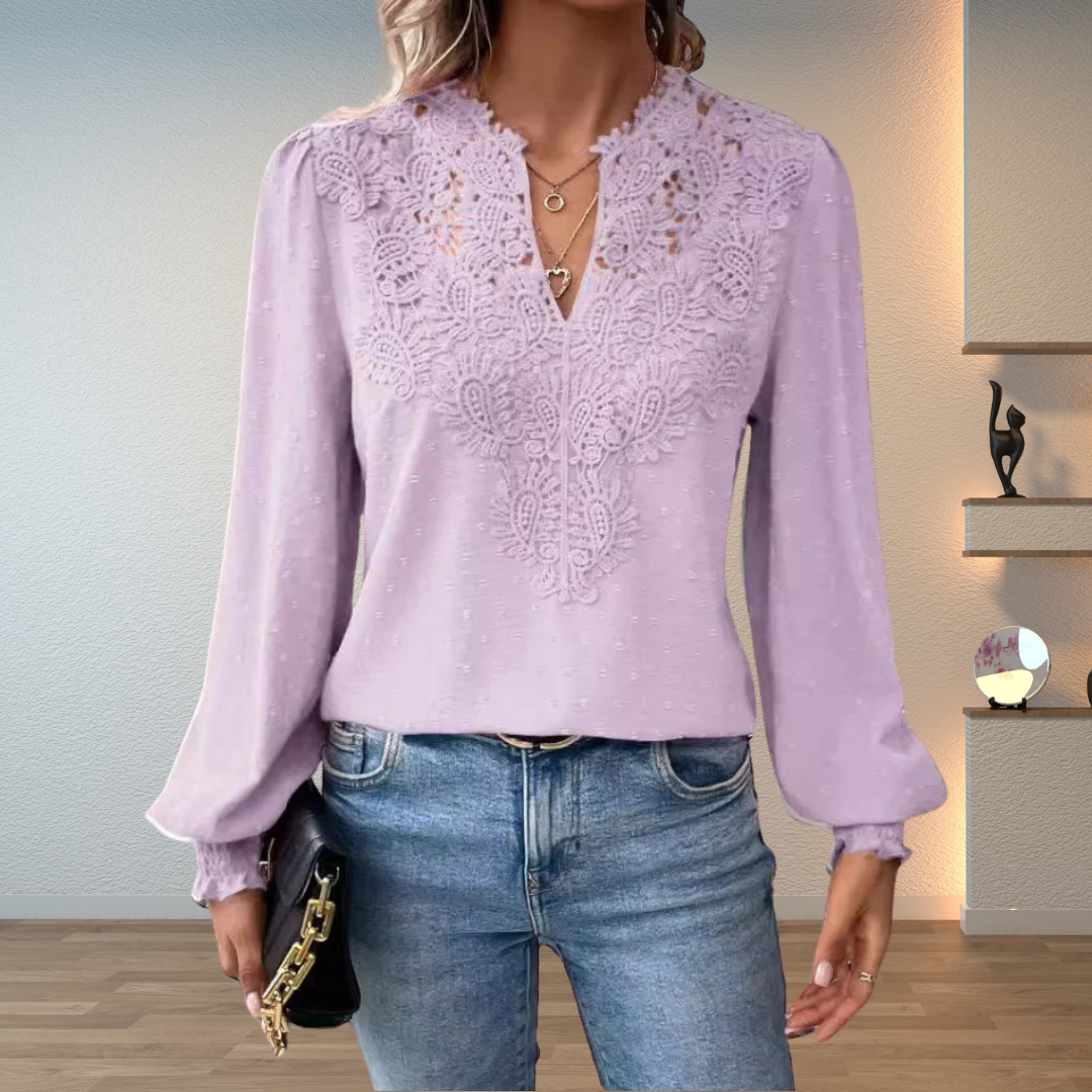 Chic women's embroidered V-neck blouse with flowy long sleeves, perfect for an elegant yet casual fashion statement.