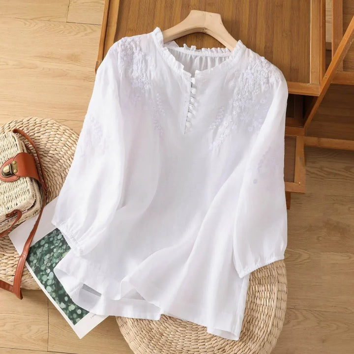 Elegant women's button-down blouse, vintage embroidered design, long sleeves. A sophisticated and fashionable top.