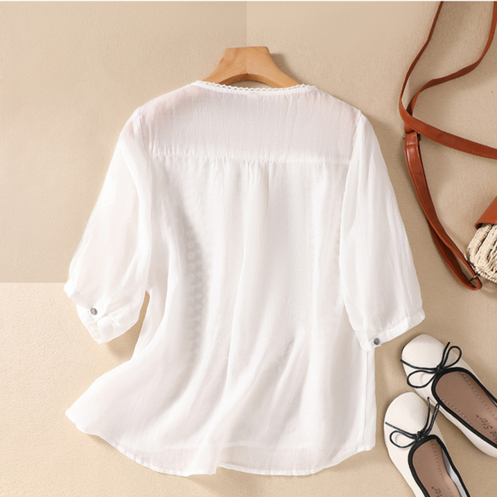 Relaxed fit women's lace blouse, perfect casual wear summer top with intricate floral detailing.