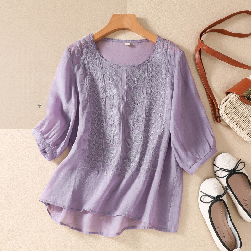 Stylish women's summer blouse made of delicate floral lace, ideal for warm weather apparel.