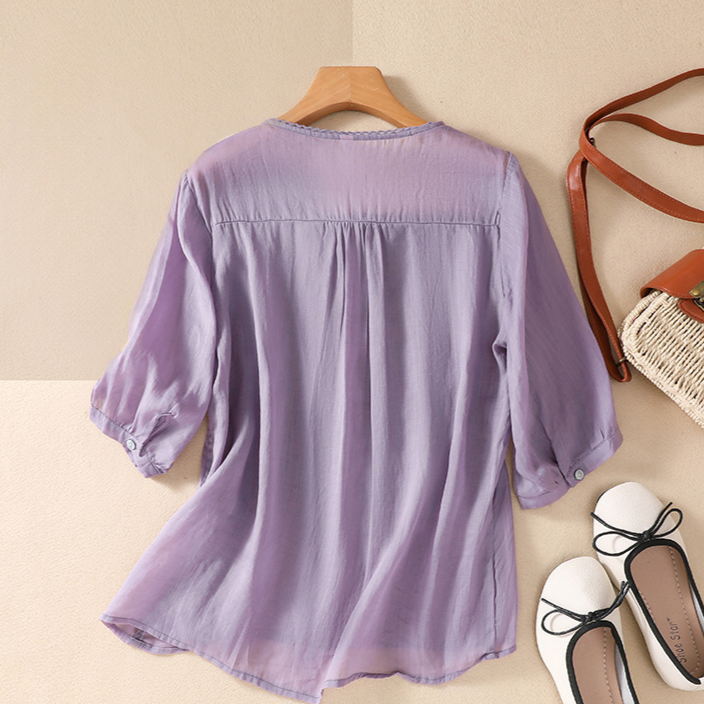Esmeralda women's lace top, a beautiful and breathable summer blouse with elegant floral patterns.