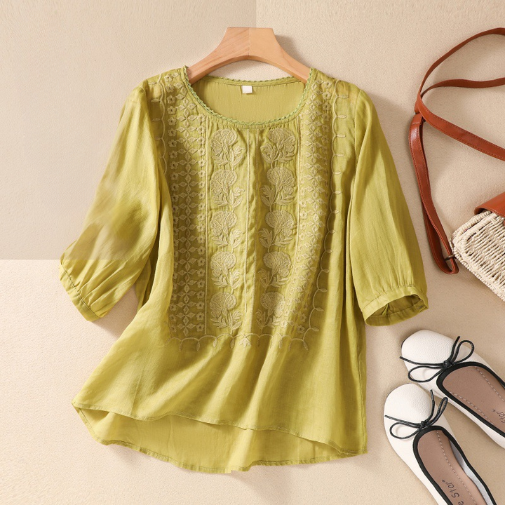 Chic women's lace top, the Esmeralda summer blouse combines casual wear with elegant floral design.