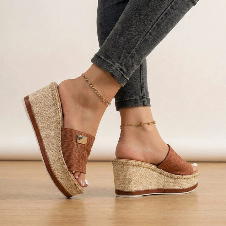 Comfortable women's espadrille wedge sandals feature chic textured straps for elegant summer style.