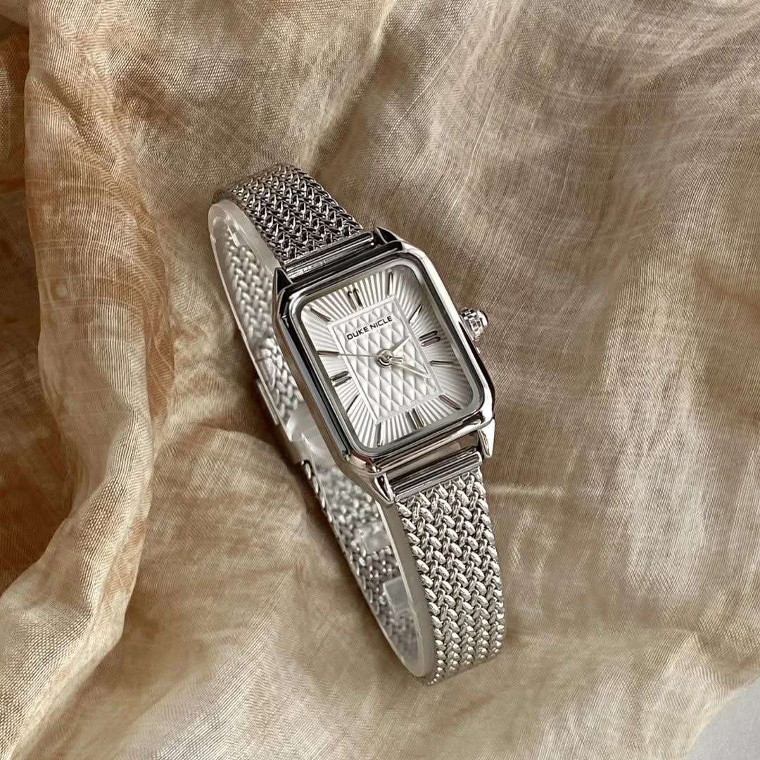 Close-up of Estella women's elegant daily wristwatch dial, showcasing the sleek design and classic numbers.
