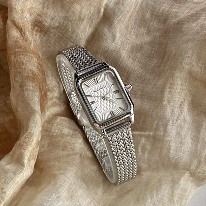 Close-up of Estella women's elegant daily wristwatch dial, showcasing the sleek design and classic numbers.