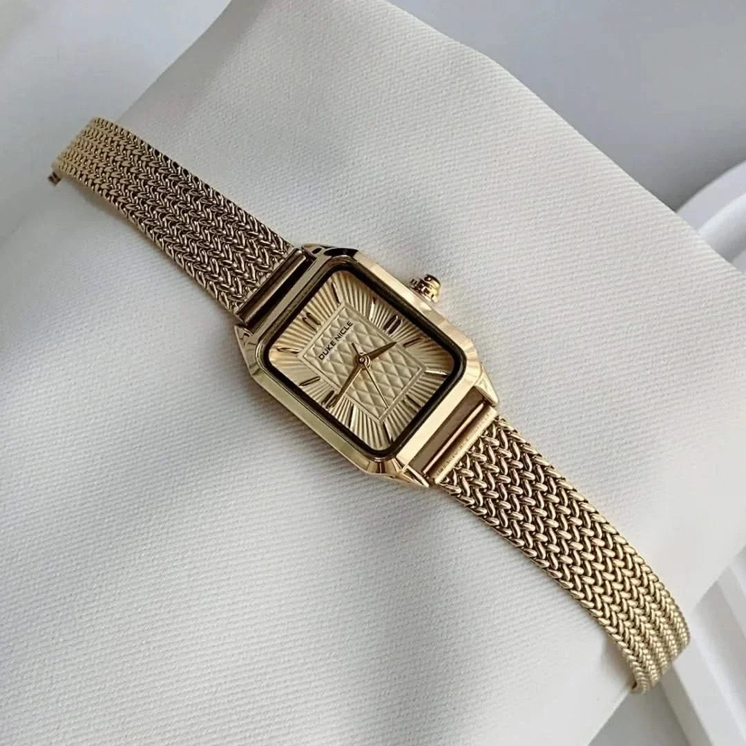 Estella women's gold tone wristwatch, elegant daily accessory, classic timepiece with sleek adjustable design.