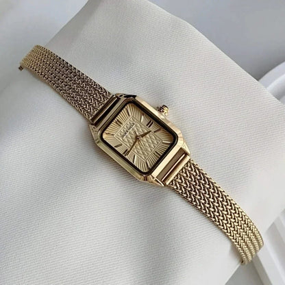Estella women's gold tone wristwatch, elegant daily accessory, classic timepiece with sleek adjustable design.