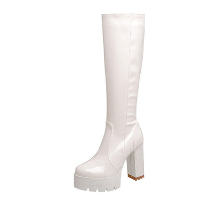 Elegant women's studded black long boots with platform & chunky heels. Stylish footwear for fall & winter fashion.
