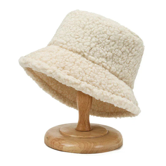 Women's fashionable plush bucket hat for winter. Cozy faux fur headwear.