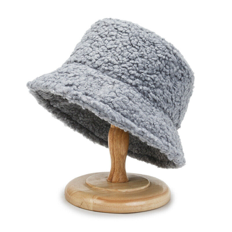 Fashionable women's plush bucket hat. Trendy faux fur headwear for warm winter style.