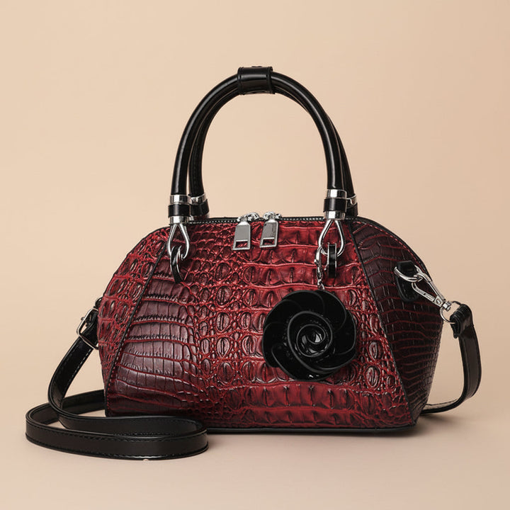 Elegant women's day to night alligator bag, textured faux leather shoulder accessory.