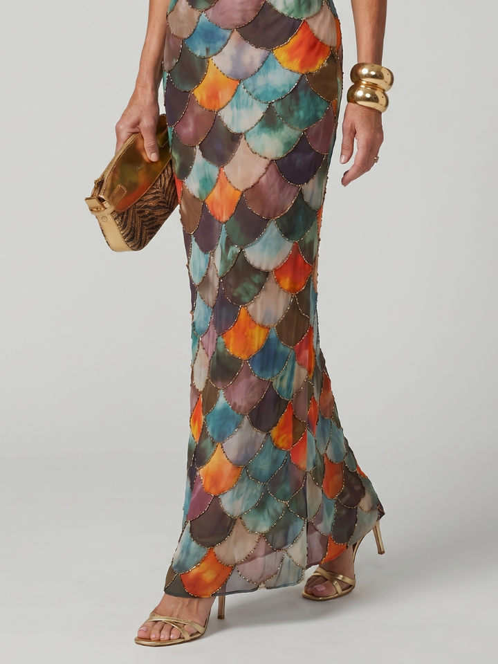 Close-up of a stylish pull-on halter maxi dress for women, showcasing its intricate geometric scale pattern.