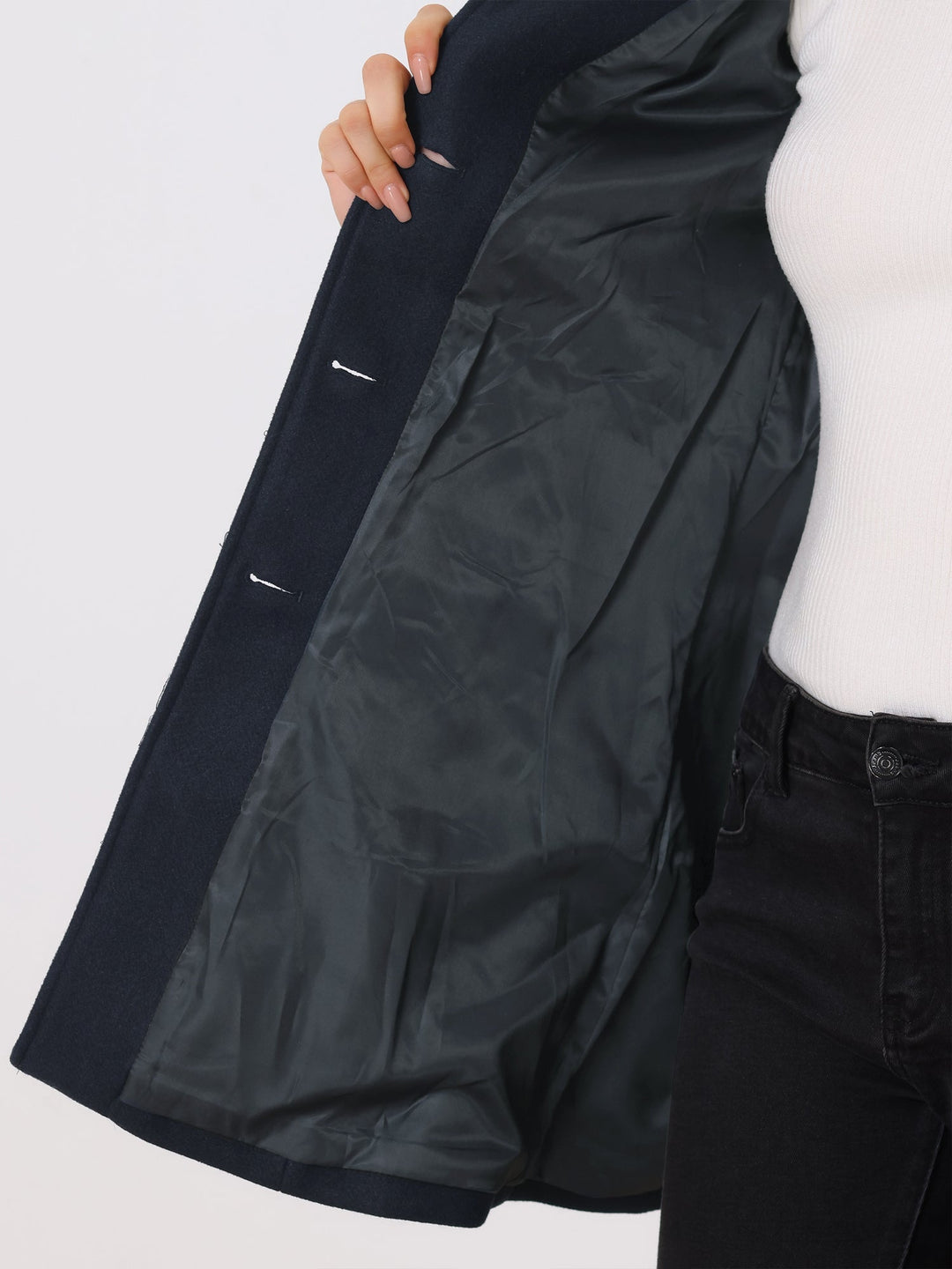 Stylish women's fitted trench coat. Versatile workwear outerwear featuring elegant button closure.