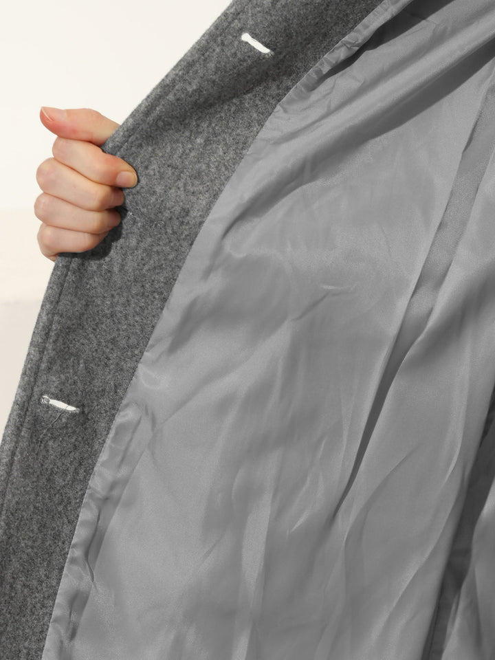 Versatile women's fitted trench coat, classic design with elegant button closure.
