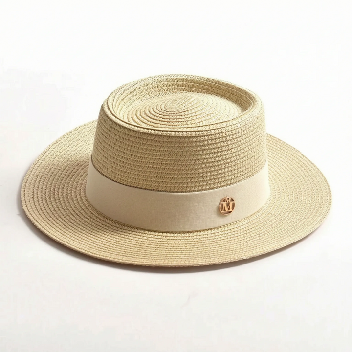 Chic women's resort wear hat. Woven flat top sun hat with a wide brim, adding style to any summer outfit.