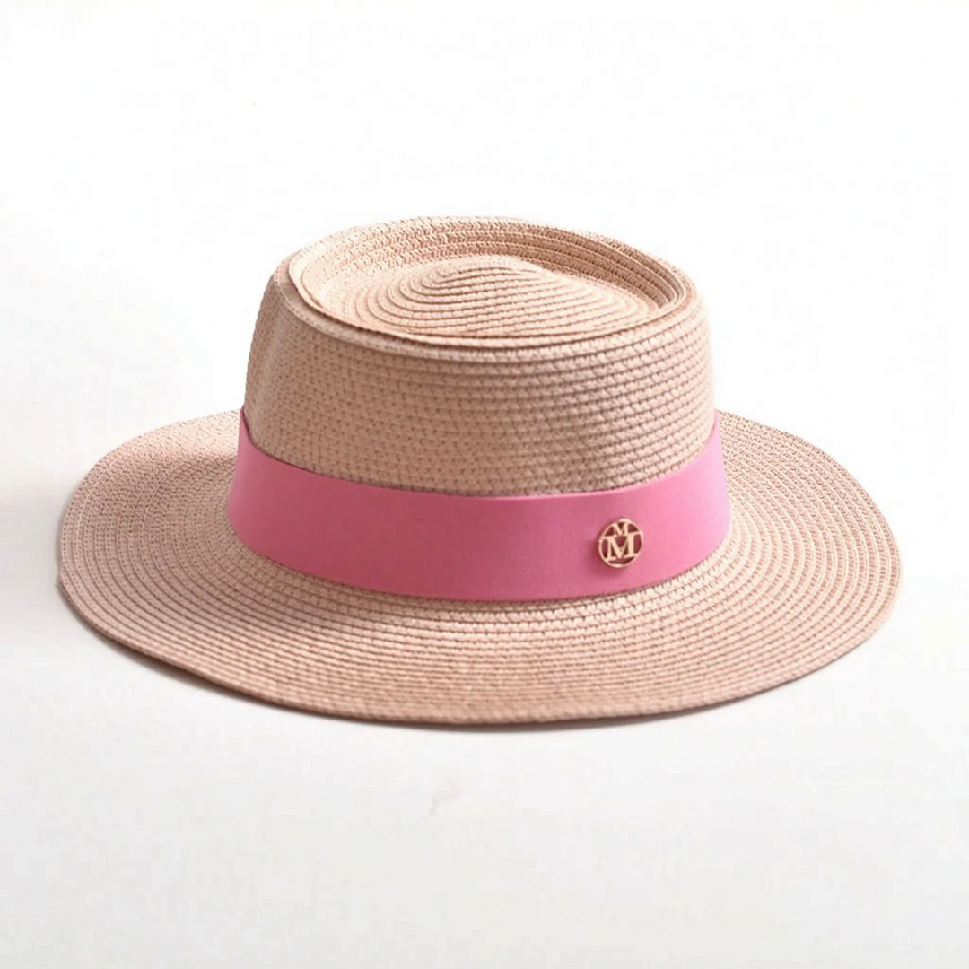 Fashionable women's woven sun hat with a flat top and wide brim for summer, vacation, and resort elegance.