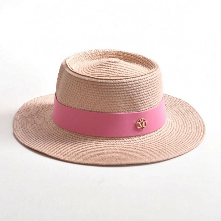 Fashionable women's woven sun hat with a flat top and wide brim for summer, vacation, and resort elegance.