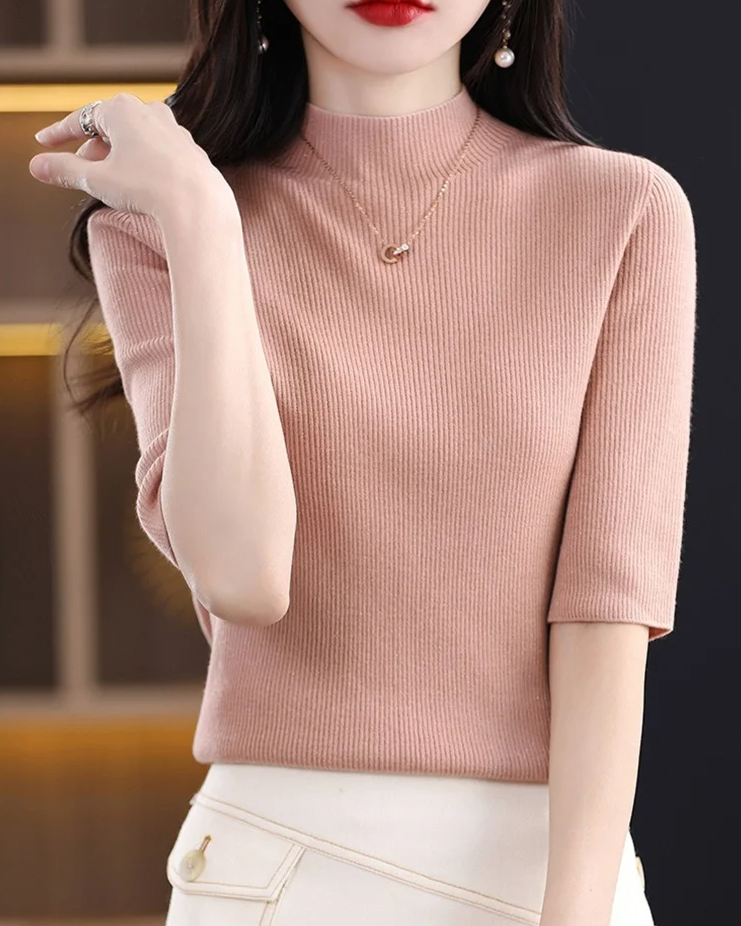 Elegant women's ribbed knit top, easily dressed up or down. Flattering long sleeve comfort for daily wear.