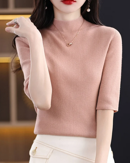 Elegant women's ribbed knit top, easily dressed up or down. Flattering long sleeve comfort for daily wear.