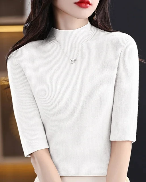 Everyday women's ribbed knit long sleeve top, flattering and comfortably versatile for casual elegance.