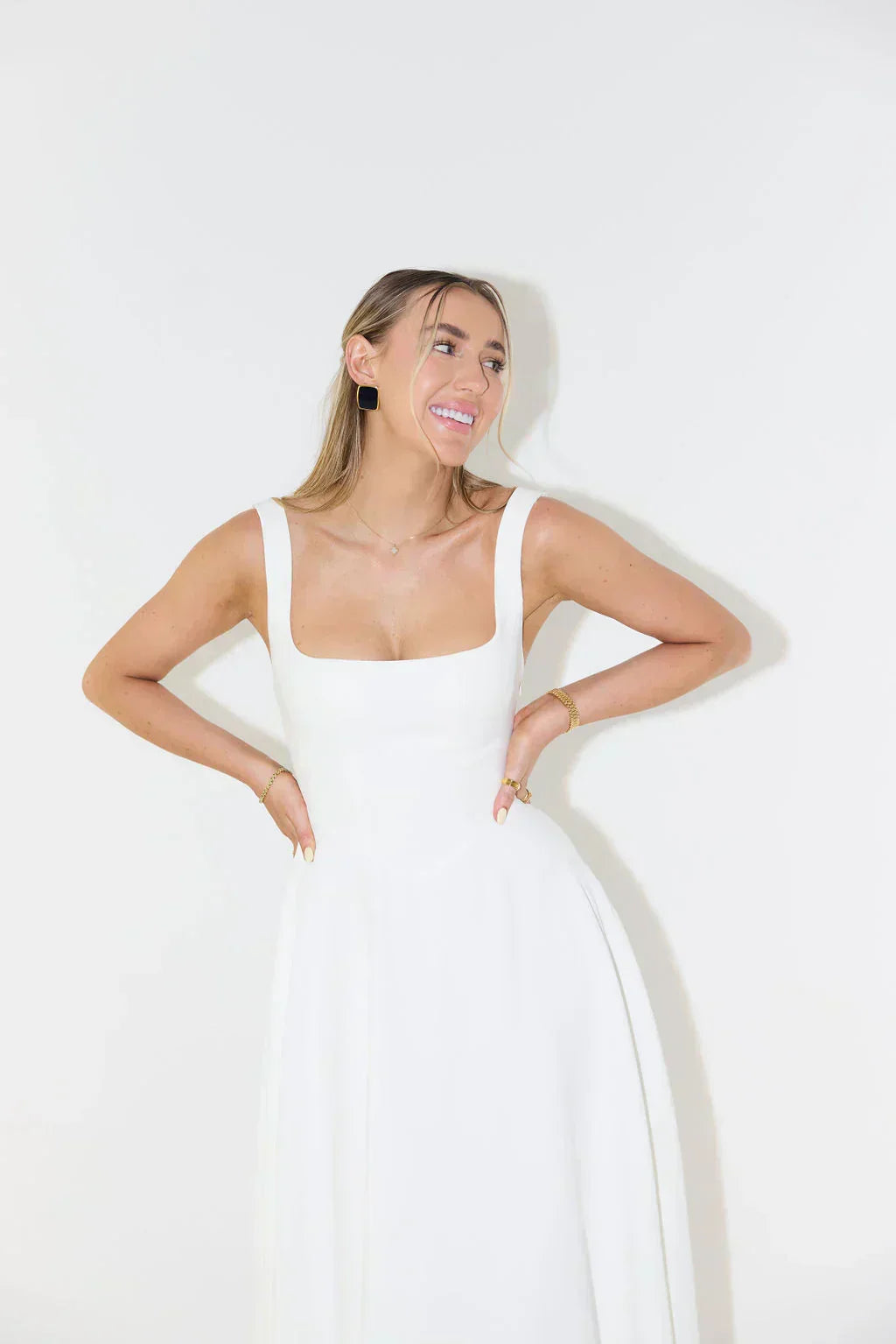Chic fashion women's midi dress with a flattering square neckline, ideal for elegant styling.