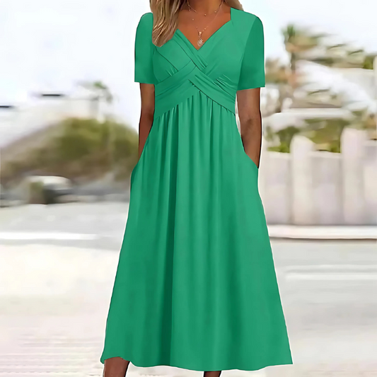 Women's flattering V-neck A-line midi dress with pockets, perfect for elegant summer wear.
