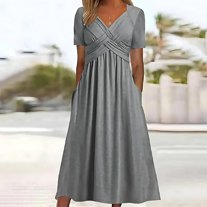 Summer-ready flattering V-neck midi dress for women, an A-line style with functional pockets.