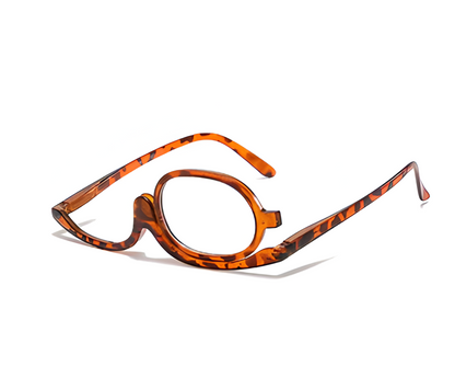 Precision makeup reading glasses with a convenient flip-lens for women's detailed cosmetic application.