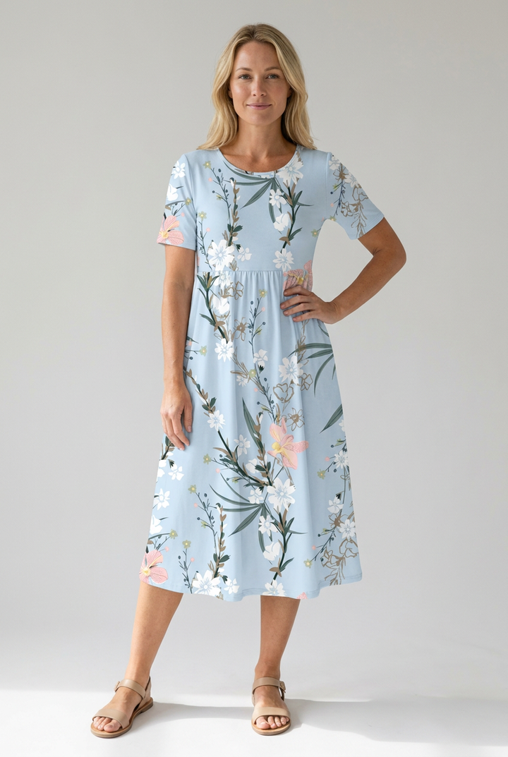 Stylish women's floral A-line midi dress. Round neck, short sleeves. Versatile for elegant or casual summer fashion.