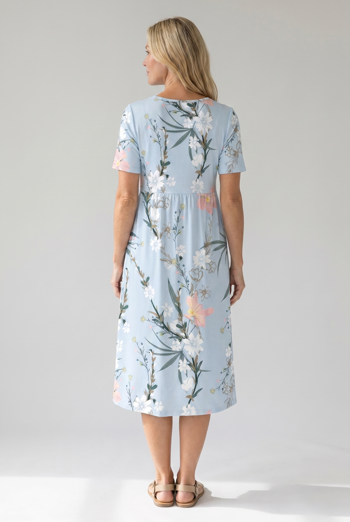 Beautiful women's floral A-line midi dress for spring. Round neck, short sleeve, a comfortable everyday summer dress.