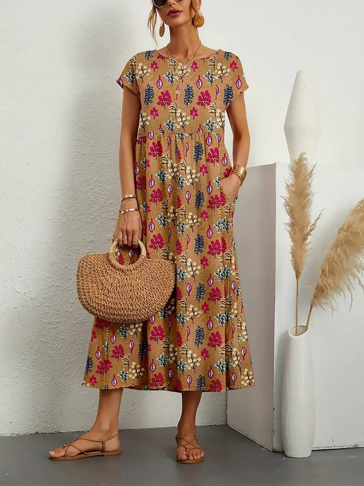 Stylish women's floral A-line dress with short sleeves and pockets, great for casual and comfortable day wear.