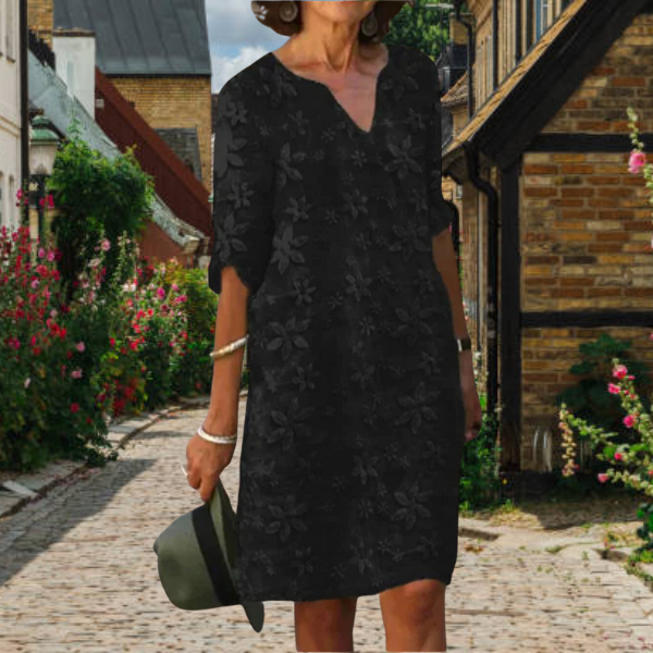 Relaxed fit women's summer midi dress featuring elegant floral appliqués & a stylish notch neck.