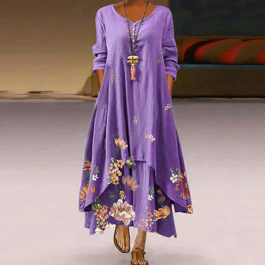 Elegant women's maxi dress with vibrant floral border print. Long sleeve, A-line, casual spring/summer fashion.