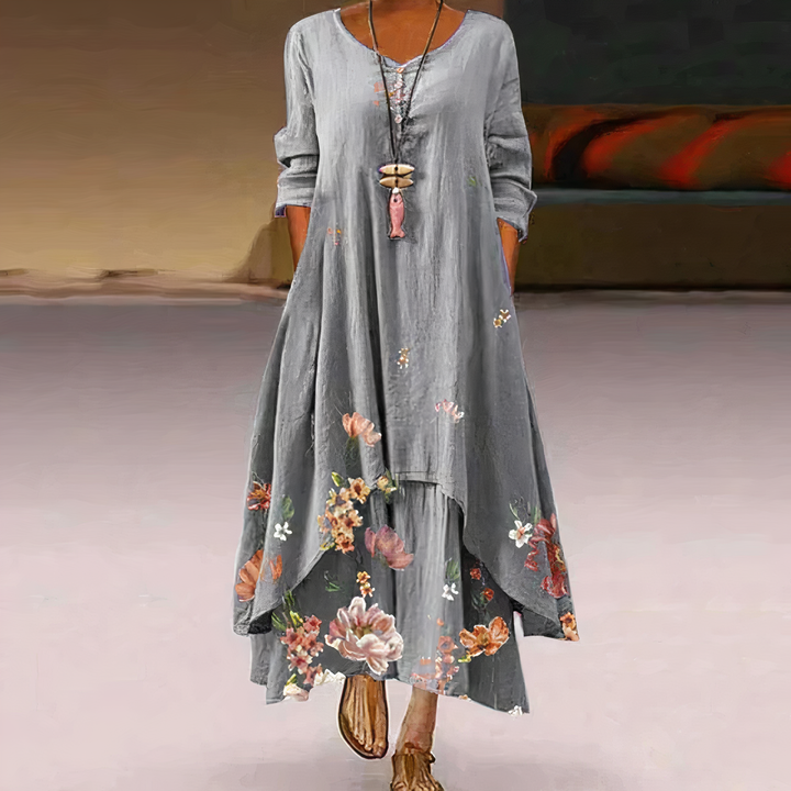 Close-up of intricate floral border print on a women's long sleeve maxi dress fabric, showing quality and detail.