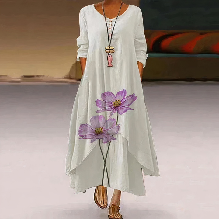 Women's long sleeve floral print maxi dress on hanger. Oversized, V-neck, A-line. Great for bohemian spring/summer.