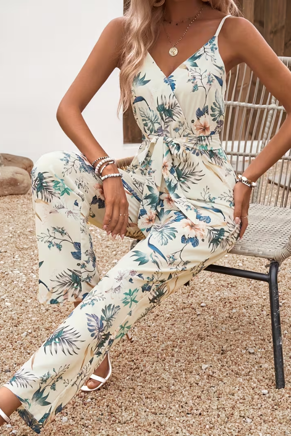 Elegant women's floral sleeveless jumpsuit with tie waist, ideal for comfortable daytime or vacation wear.
