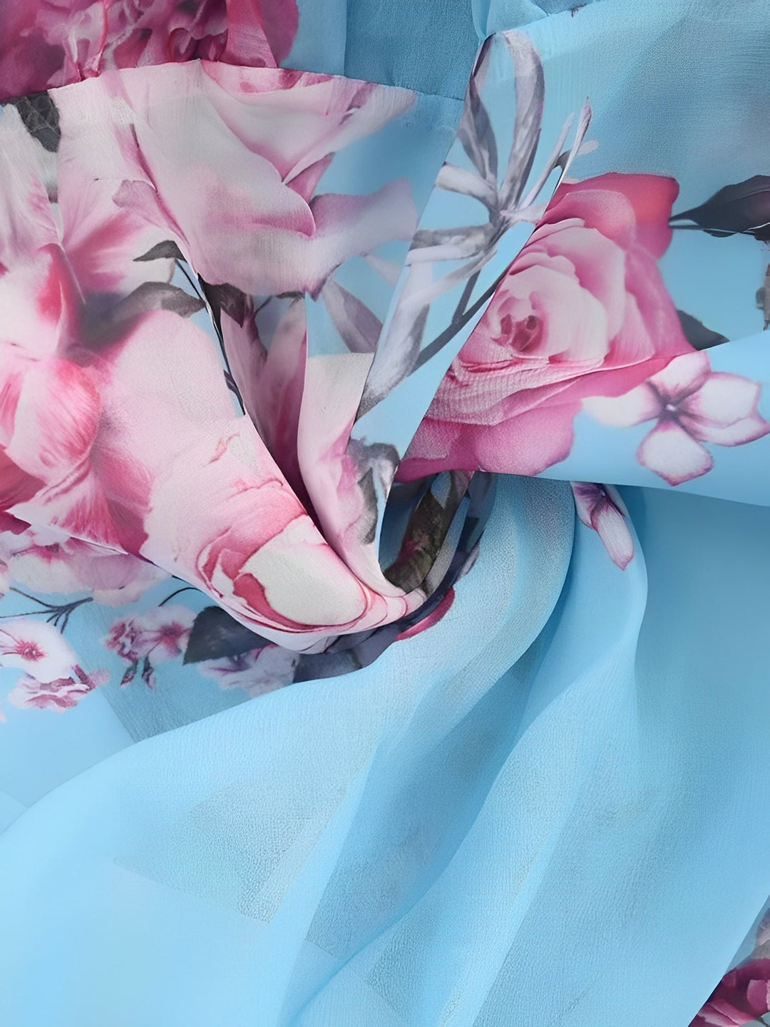 Back view of the women's flowy floral cold shoulder mini dress, featuring a soft print.