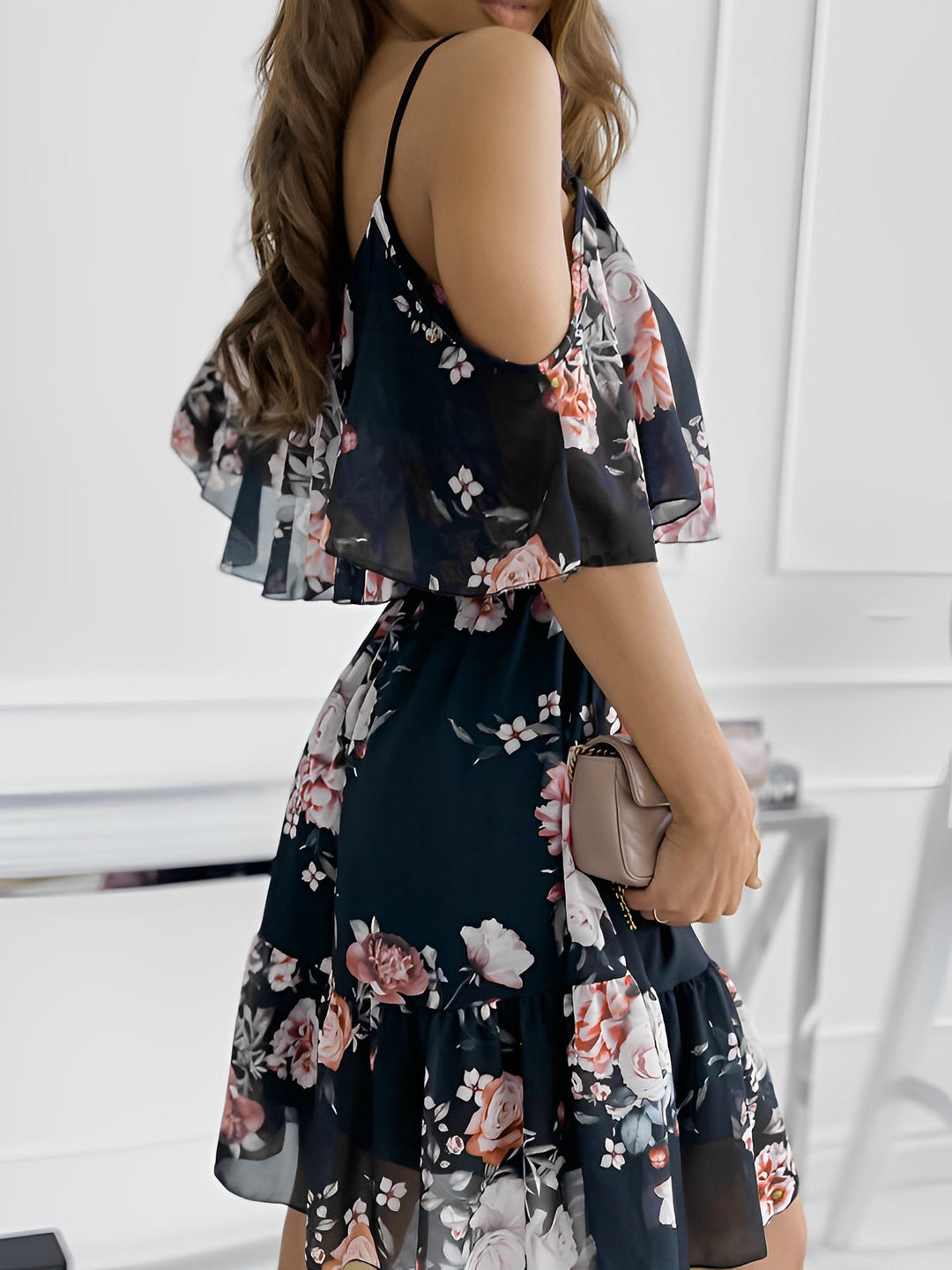 Bohemian-inspired floral cold shoulder mini dress with ruffles, a must-have summer dress.