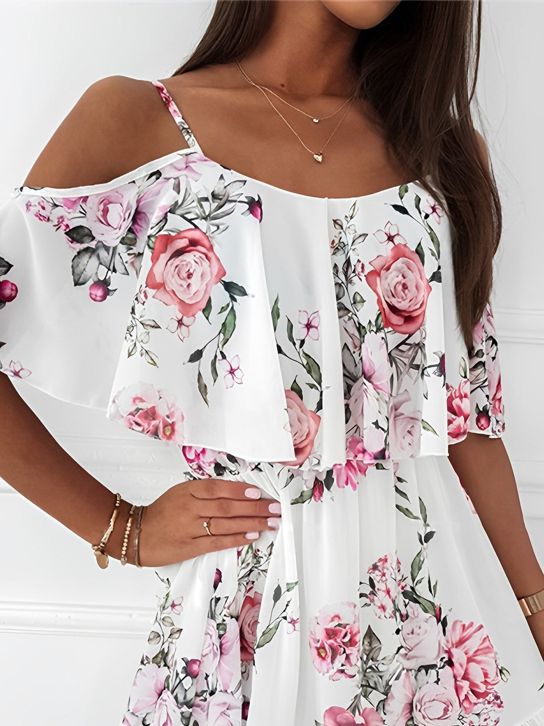 Flowy floral cold shoulder mini dress, a feminine summer vacation outfit for women.
