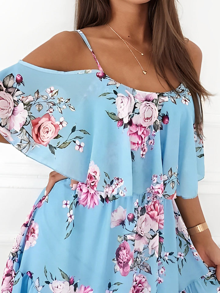 Comfortable women's floral mini dress with cold shoulder cutouts and a flirty ruffle hem.