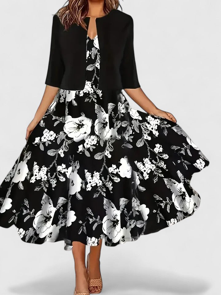 Chic women's A-line midi dress with floral colorblock design, notch neck, and 3/4 sleeves.
