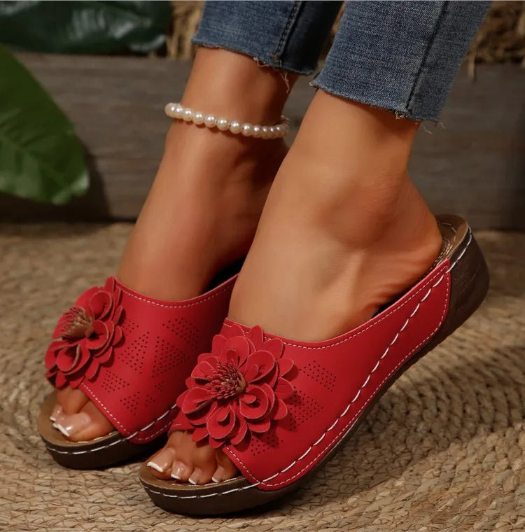 Elegant floral design on women's comfort slide sandals, open-toe fashion footwear.