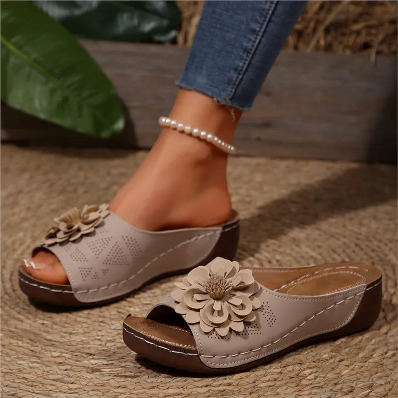 A pair of women's floral comfort slide sandals, stylish spring & summer footwear.